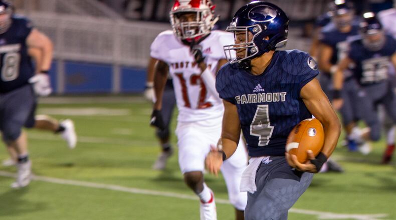 Fairmont quarterback Male'k Hillon runs for a first down during the first half of Friday night's game against Trotwood-Madison at Fairmont. Jeff Gilbert/CONTRIBUTED