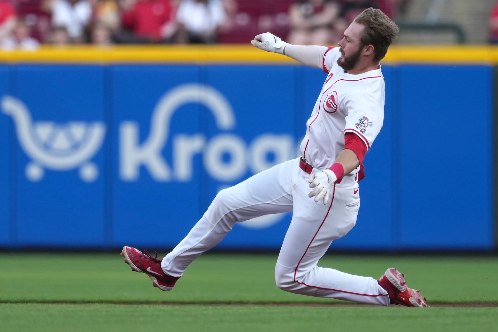 Cincinnati Reds' Gavin Lux slides into second base after hitting a double in the second inning of a baseball game against the St. Louis Cardinals, Monday, April 28, 2025, in Cincinnati. (AP Photo/Kareem Elgazzar)