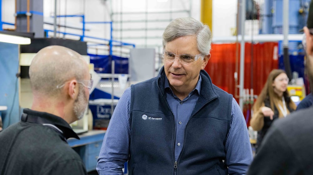 Larry Culp, chairman and CEO of GE Aerospace, with an unnamed employee at the company's Beavercreek plant. GE Aerospace photo.