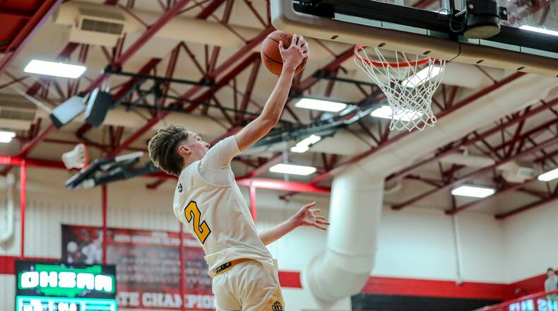 Centerville High School senior Eli Greenberg drives to the hoop during their Division I district semifinal game against Springfield on Tuesday night at Trotwood Madison High School. MICHAEL COOPERSTAFF PHOTO