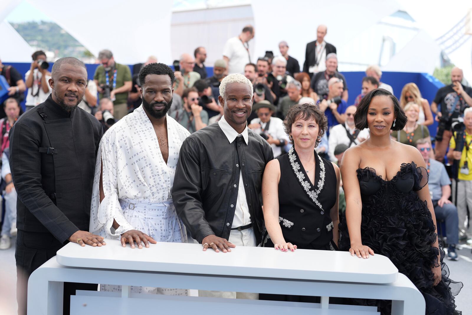 Wale Davies, from left, Sope Dirisu, director Akinola Davies, producer Rachel Dargavel and producer Funmbi Ogunbanwo pose for photographers at the photo call for the film 'My Father's Shadow' at the 78th international film festival, Cannes, southern France, Sunday, May 18, 2025. (AP Photo/Natacha Pisarenko)