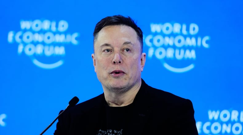 Elon Musk attends the Annual Meeting of the World Economic Forum in Davos, Switzerland, Thursday, Jan. 22, 2026. (AP Photo/Markus Schreiber)