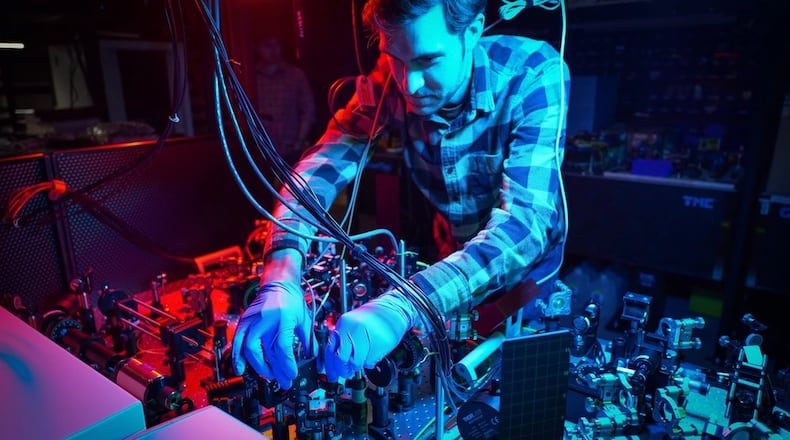A researcher at the Air Force Research Laboratory Information Directorate works in the Photonics Laboratory in this 2023 photo. Air Force photo / Keith Lewis