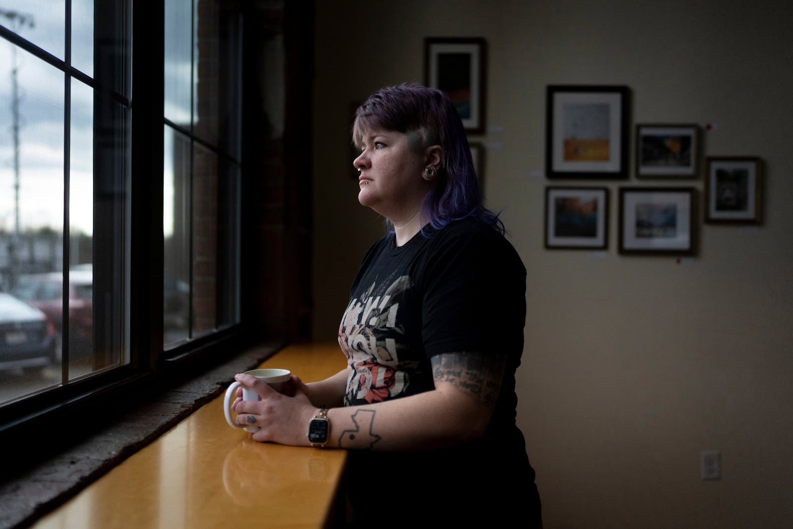 Renee Colon, co-owner of Fuego Coffee Roasters, stands for a photo, Saturday, March 22, 2025, in Rochester, N.Y. (Max Conway via AP)