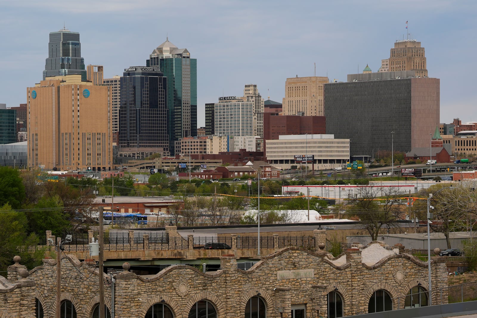 The Richard Bolling federal building is seen at right among other downtown landmarks, Monday, April 14, 2025, in Kansas City, Mo. (AP Photo/Charlie Riedel)