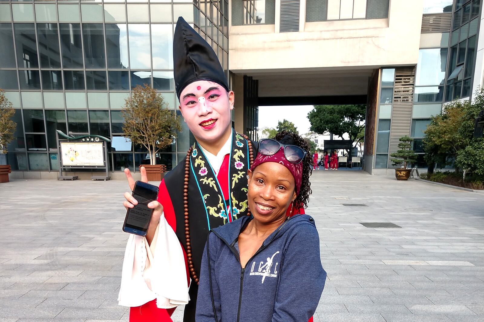 Sheri "Sparkle" Williams with an actor in Suzhou, China. CONTRIBUTED PHOTO