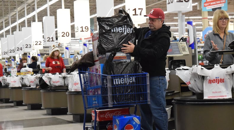 Hundreds of shoppers waited in lines at the Kettering Meijer Thanksgiving morning for televisions, Apple products and other deals. STAFF PHOTO / HOLLY SHIVELY