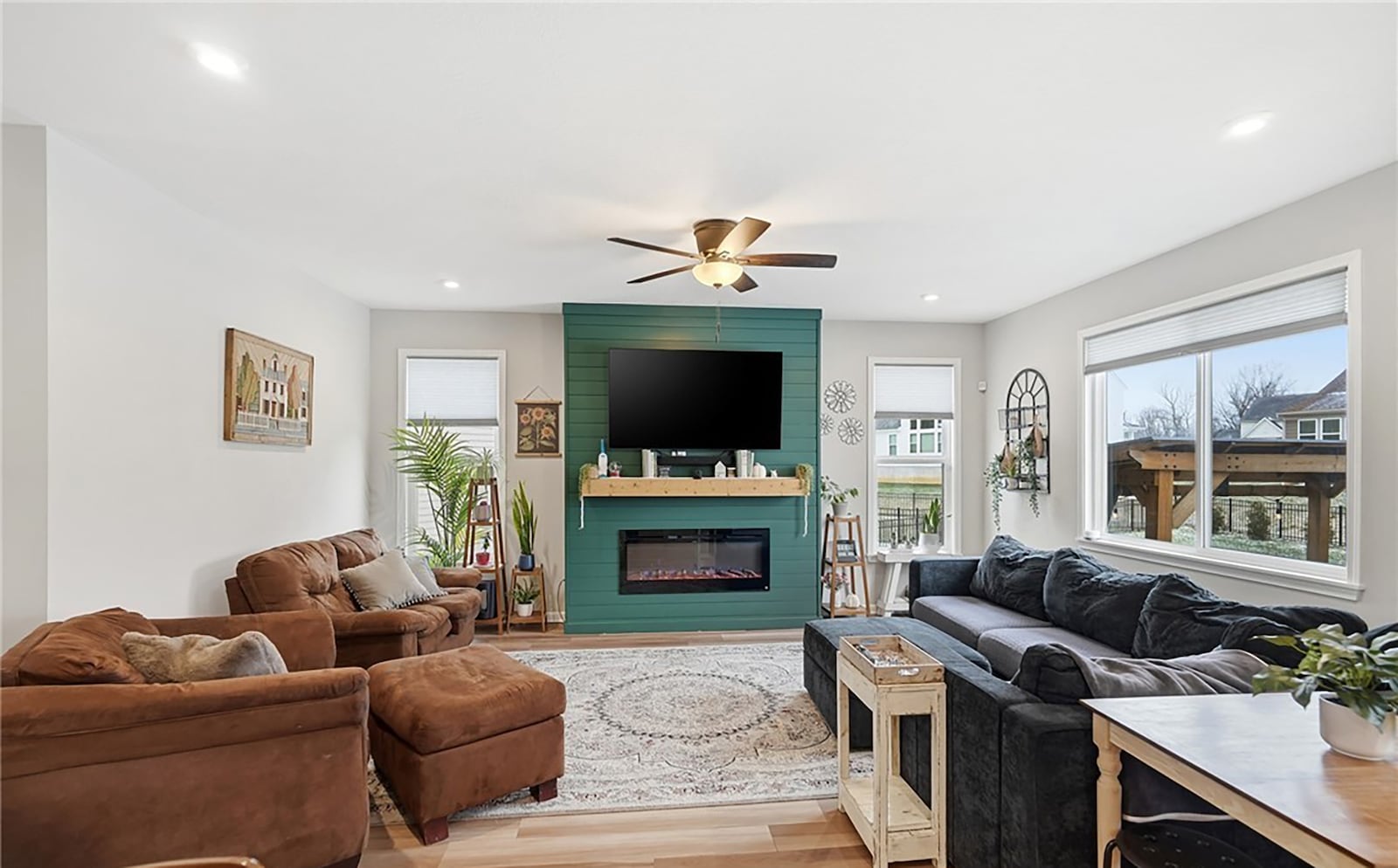 The family room has an electric fireplace and a ceiling fan. CONTRIBUTED
