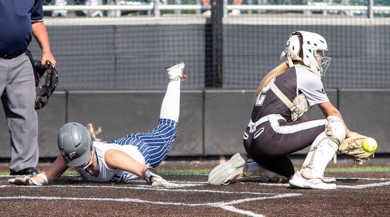 Fairmont's Paige Russell scores against Mason during Thursday's Division I district final at Mason High School. Jeff Gilbert/CONTRIBUTED
