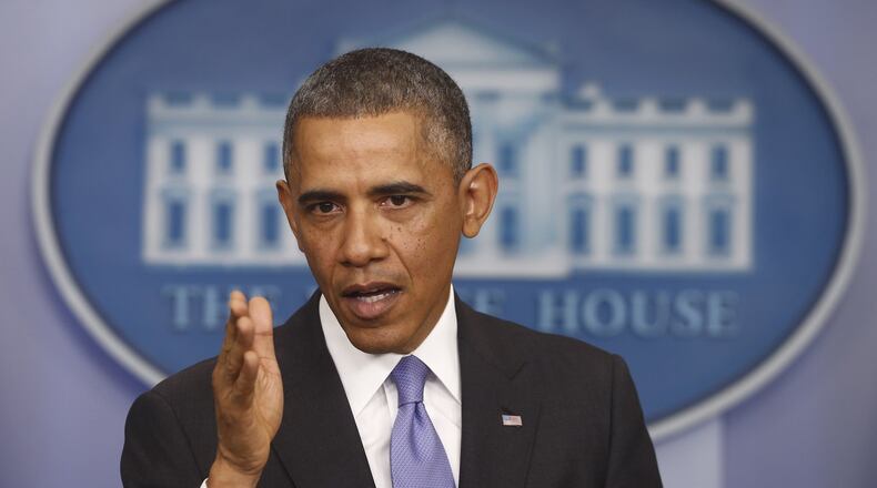 President Barack Obama speaks about his signature health care law in the Brady Press Briefing Room at the White House in Washington, Thursday, Nov. 14, 2013. Bowing to pressure, President Barack Obama intends to permit continued sale of individual insurance plans that have been canceled because they failed to meet coverage standards under the health care law, officials said Thursday. (AP Photo/Charles Dharapak)
