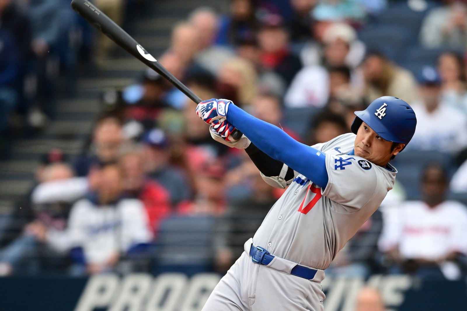 Los Angeles Dodgers' Shohei Ohtani watches his ball after hitting a two run home run off Cleveland Guardians starting pitcher Tanner Bibee during the fourth inning of a baseball game, Tuesday, May 27, 2025, in Cleveland. (AP Photo/David Dermer)