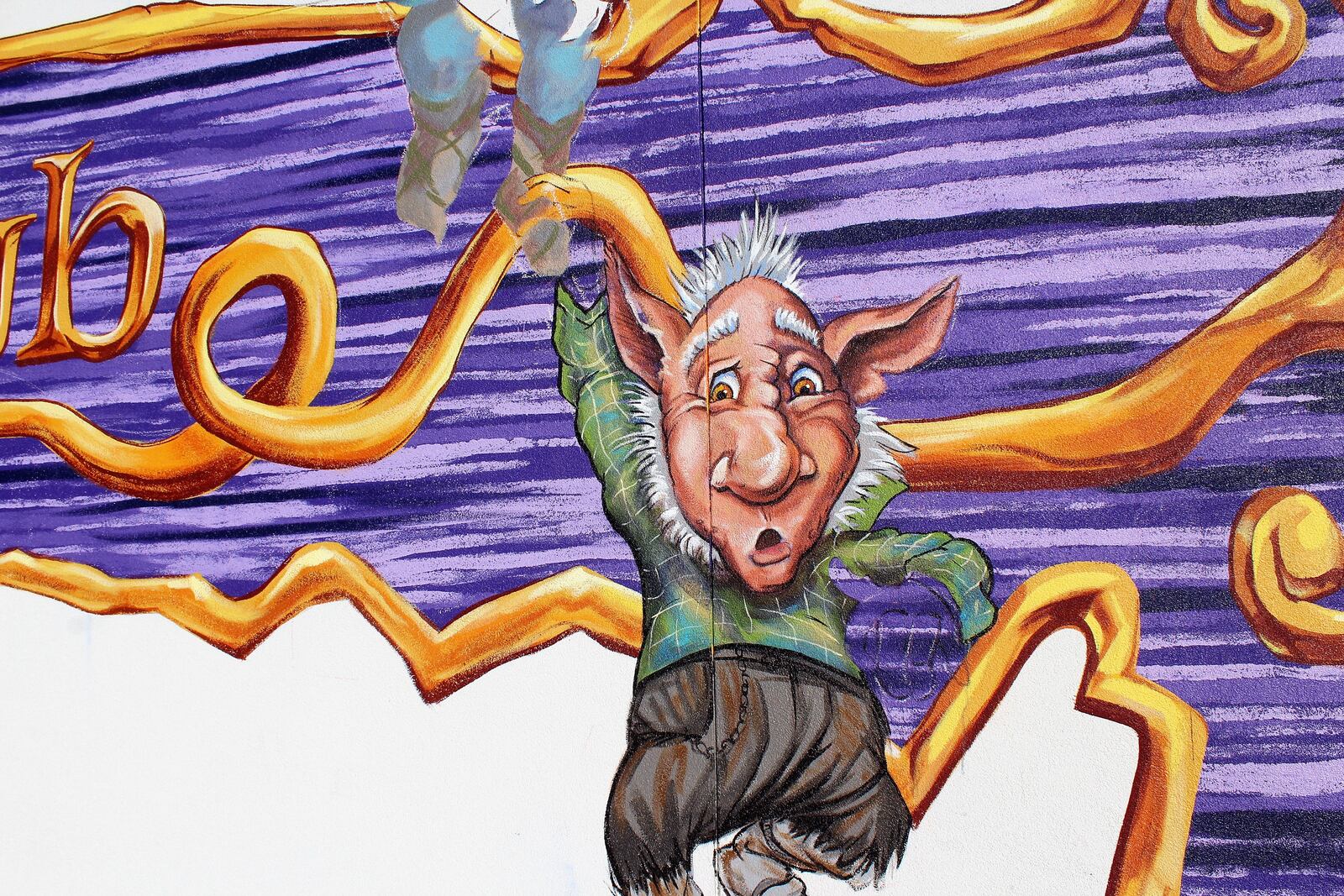 A trio of trolls are being painted on the Wheelhouse building directing people to the the future location of Troll Pub in Dayton's historic Oregon District. Photo by Amelia Robinson