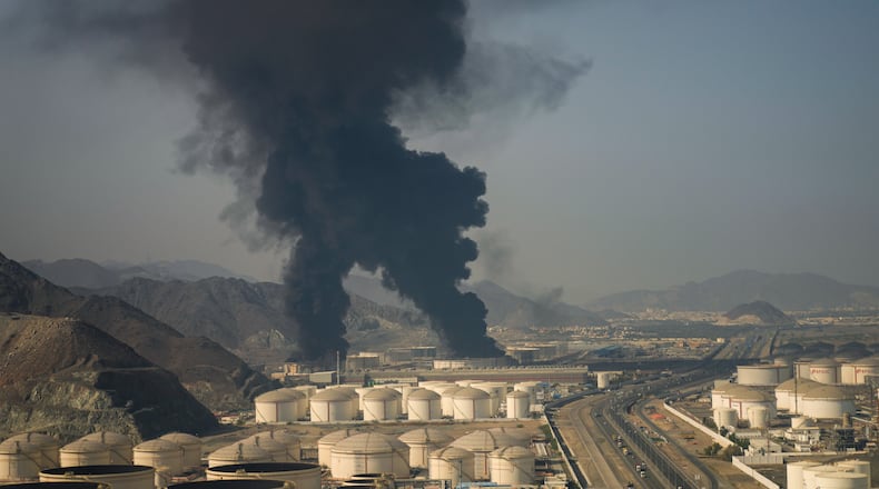 Fire and plumes of smoke rise from an oil facility in Fujairah, United Arab Emirates, Saturday, March 14, 2026. (AP Photo/Altaf Qadri)