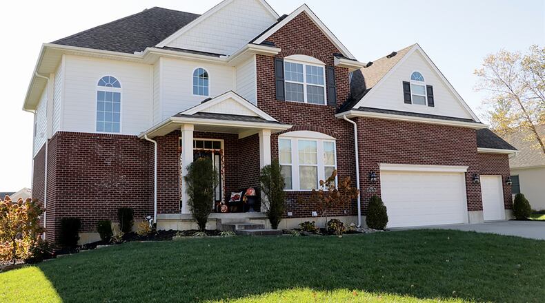 The brick-and-frame two-story has about 4,440 sq. ft. of living space, which includes the finished lower level. A homeowners association includes the use of the community’s swimming pool, tennis courts, children’s pool, clubhouse and walking trails. CONTRIBUTED PHOTO BY KATHY TYLER