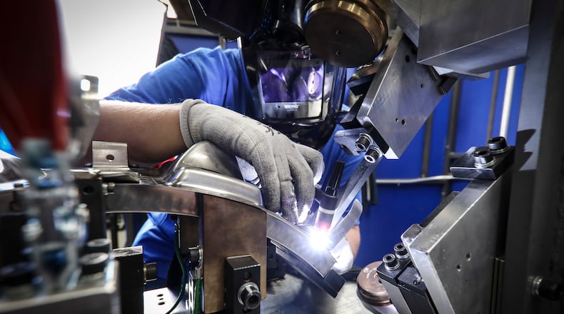 An aerospace welder at work at GE Aviation/Unison in Beavercreek. Contributed