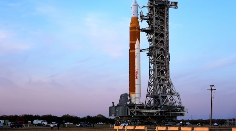 NASA's Artemis II SLS (Space Launch System) moon rocket with the Orion spacecraft slowly rolls back towards the Vehicle Assembly Building at the Kennedy Space Center, Wednesday, Feb. 25, 2026, in Cape Canaveral, Fla. (AP Photo/John Raoux)