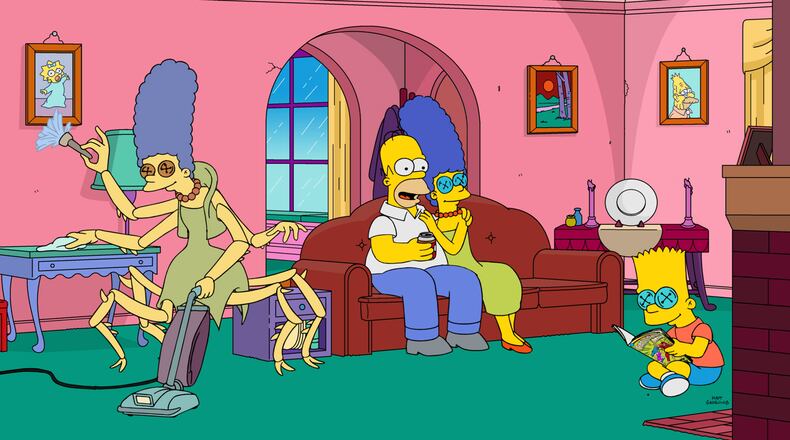 Maggie becomes possessed by an ancient demon, Lisa discovers a creepy/perfect version of her family in an alternate universe, and Homer cannibalizes himself in The Simpsons' "Treehouse of Horror XXVIII" episode. (Fox)
