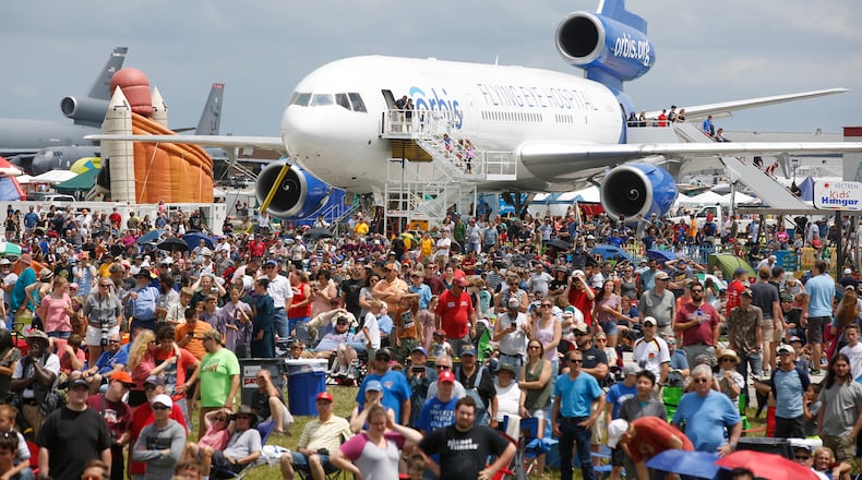A thick crowd watches the performers on Saturday at the Vectren Dayton Air Show. TY GREENLEES / STAFF