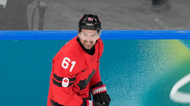 Canada's Mark Stone (61) celebrates after scoring a goal during a preliminary round game of men's ice hockey between Canada and France at the 2026 Winter Olympics, in Milan, Italy, Sunday, Feb. 15, 2026. (AP Photo/Hassan Ammar)