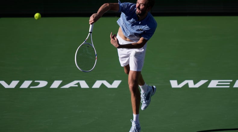 Daniil Medvedev, of Russia, serves against Carlos Alcaraz, of Spain, during a semifinal match at the BNP Paribas Open tennis tournament, Saturday, March 14, 2026, in Indian Wells, Calif. (AP Photo/Mark J. Terrill)