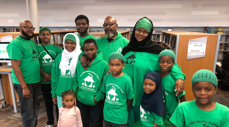 Dayton area resident shared stories of survival as part of the Dayton Strong Storytelling Sessions recorded at the Dayton Metro Library.  Darrow Miller (far left) and his sister Elisha Osama (center) of the Little Hearts School House discussed  how they helped neighbors and strangers  following the Memorial Day tornadoes.  Genesis Miller, Khadijah Bilal and  Sulaiman Bilal , Osama's children also reflect about the storm.