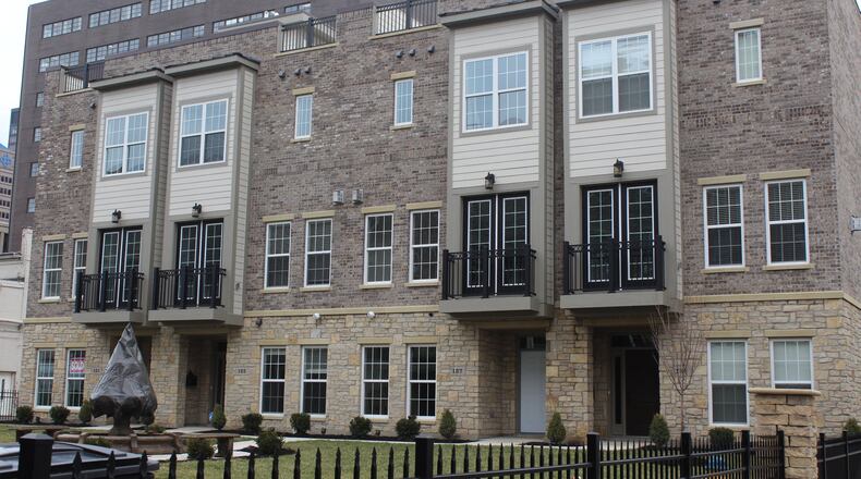 Charles Simms Development has built 117 new townhomes in greater downtown Dayton. This year will be the first year the builder isn’t constructing any new product in the greater downtown area. The company’s last home for sale in downtown is at Monument Walk. CORNELIUS FROLIK / STAFF