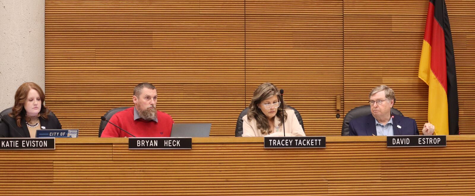 Katie Eviston, Bryan Heck, Tracey Tackett and David Estrop listen to public comment during a city commission meeting Tuesday, March 25, 2025. JESSICA OROZCO/STAFF