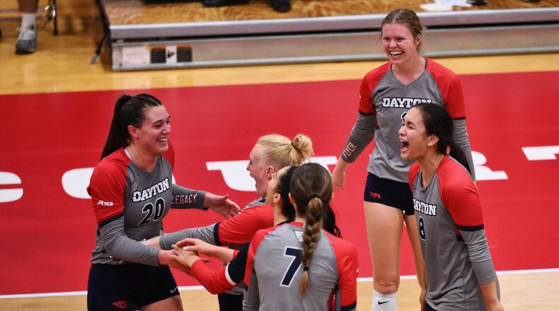 Dayton volleyball celebrates a point against Duquesne on Oct. 24, 2023, at the Frericks Center. Photo by Erik Schelkun