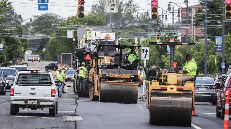 The repaving of Ohio 48 in Kettering has involved a 1.5-mile section from the Oakwood corporation line to David Road this year. In 2022, Kettering is projecting to spend $9.4 million on traffic and road improvements next, upgrading signals at several intersections and resurfacing parts of some main streets. JIM NOELKER/STAFF