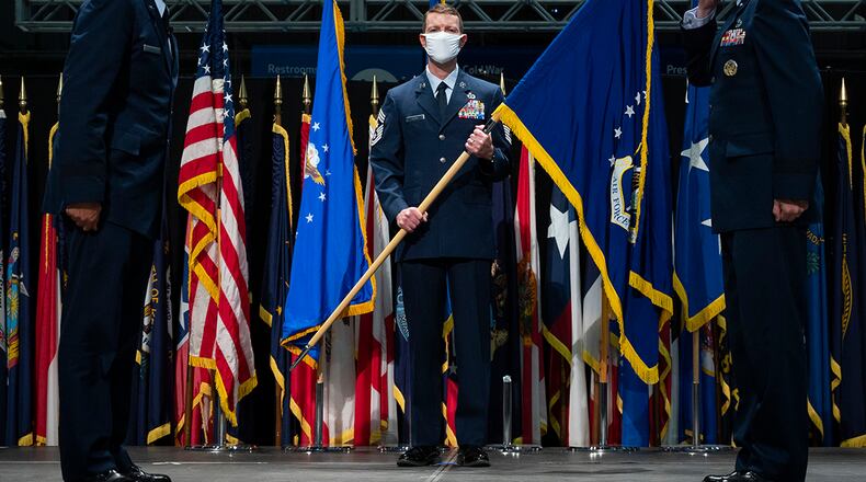 Lt. Gen. Shaun Q. Morris (right) assumes command of the Air Force Life Cycle Management Center during a change of command ceremony at the National Museum of the United States Air Force, Wright-Patterson Air Force Base Sept. 3. Gen. Arnold W. Bunch Jr., Air Force Materiel Command commander (left), presided over ceremony. Lt. Gen. Robert D. McMurry (not pictured) relinquished command of the center. The center’s command chief, Chief Master Sgt. Troie Croft (center) bore the guidon for the ceremony. (U.S. Air Force photo/Jim Varhegyi)