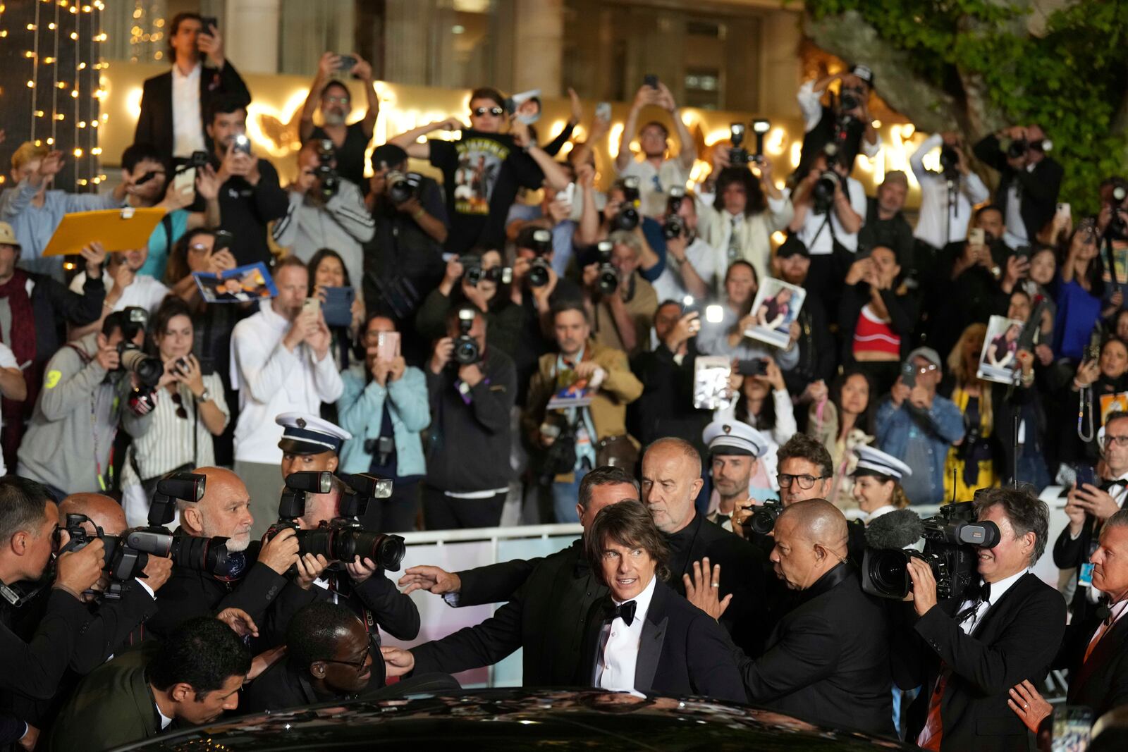 Tom Cruise upon departure from the premiere of the film 'Mission: Impossible – The Final Reckoning' at the 78th international film festival, Cannes, southern France, Wednesday, May 14, 2025. (AP Photo/Natacha Pisarenko)