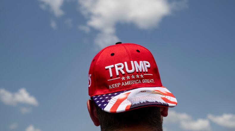 FILE — An attendee during a campaign event with Sen. JD Vance (R-Ohio), the Republican vice presidential nominee, at Cordes Inc. in Byron Center, Mich., Aug. 14, 2024. Donald Trump has branded himself as a “blue-collar billionaire” who embraces irreverence and wears trucker hats. (Emily Elconin/The New York Times)