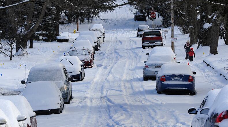 Side Streets like this one in Moraine are still snow covered Tuesday morning, Feb. 16, 2021. MARSHALL GORBY\STAFF