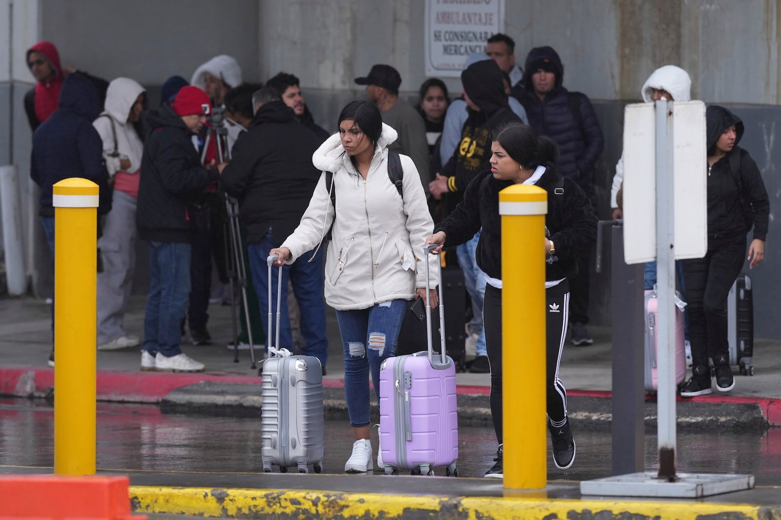FILE - Migrants seeking asylum leave an immigration office after their scheduled meetings were canceled and they were turned away soon after President Donald Trump canceled the CBP One app, Jan. 20, 2025, in Matamoros, Mexico. (AP Photo/Eric Gay, File)