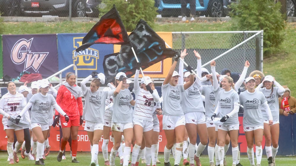 The Dayton women's soccer team celebrates a victory against Rhode Island in the Atlantic 10 Conference tournament championship game on Sunday, Nov. 9, 2025, at Baujan Field. David Jablonski/Staff