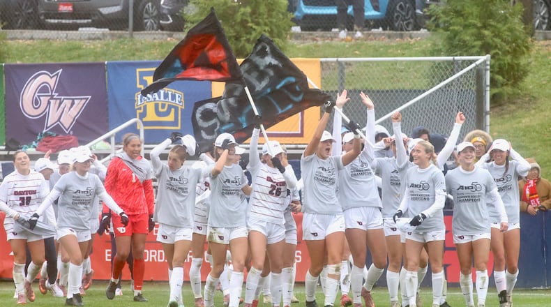 The Dayton women's soccer team celebrates a victory against Rhode Island in the Atlantic 10 Conference tournament championship game on Sunday, Nov. 9, 2025, at Baujan Field. David Jablonski/Staff