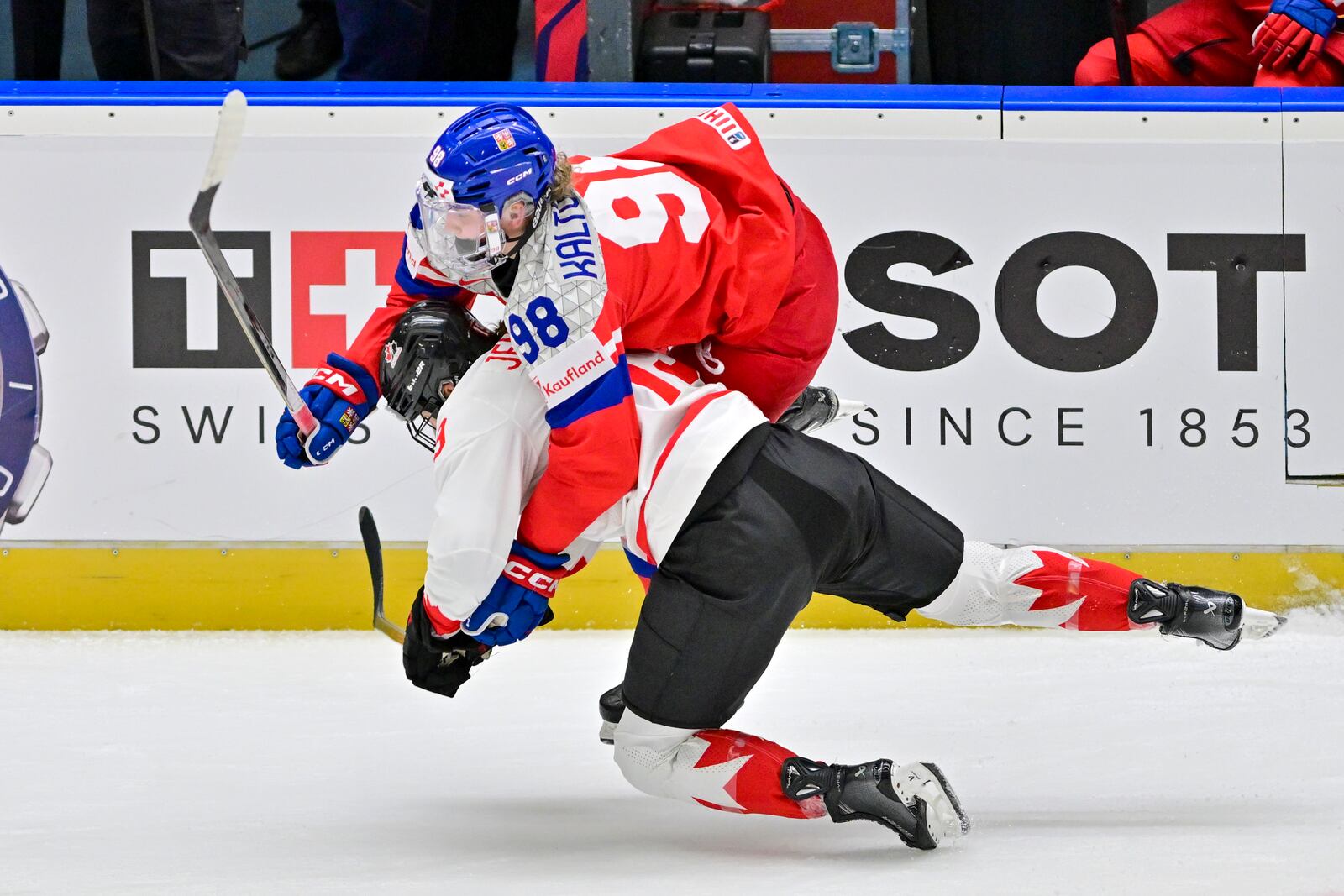 Czech Republic's Kristyna Kaltounkova, top, and Canada's Brianne Jenner in action during the IIHF Women's World Championship, Group A, match between Czech Republic and Canada, in Ceske Budejovice, Czech Republic, Monday, April 14, 2025. (Vaclav Pancer/CTK via AP)