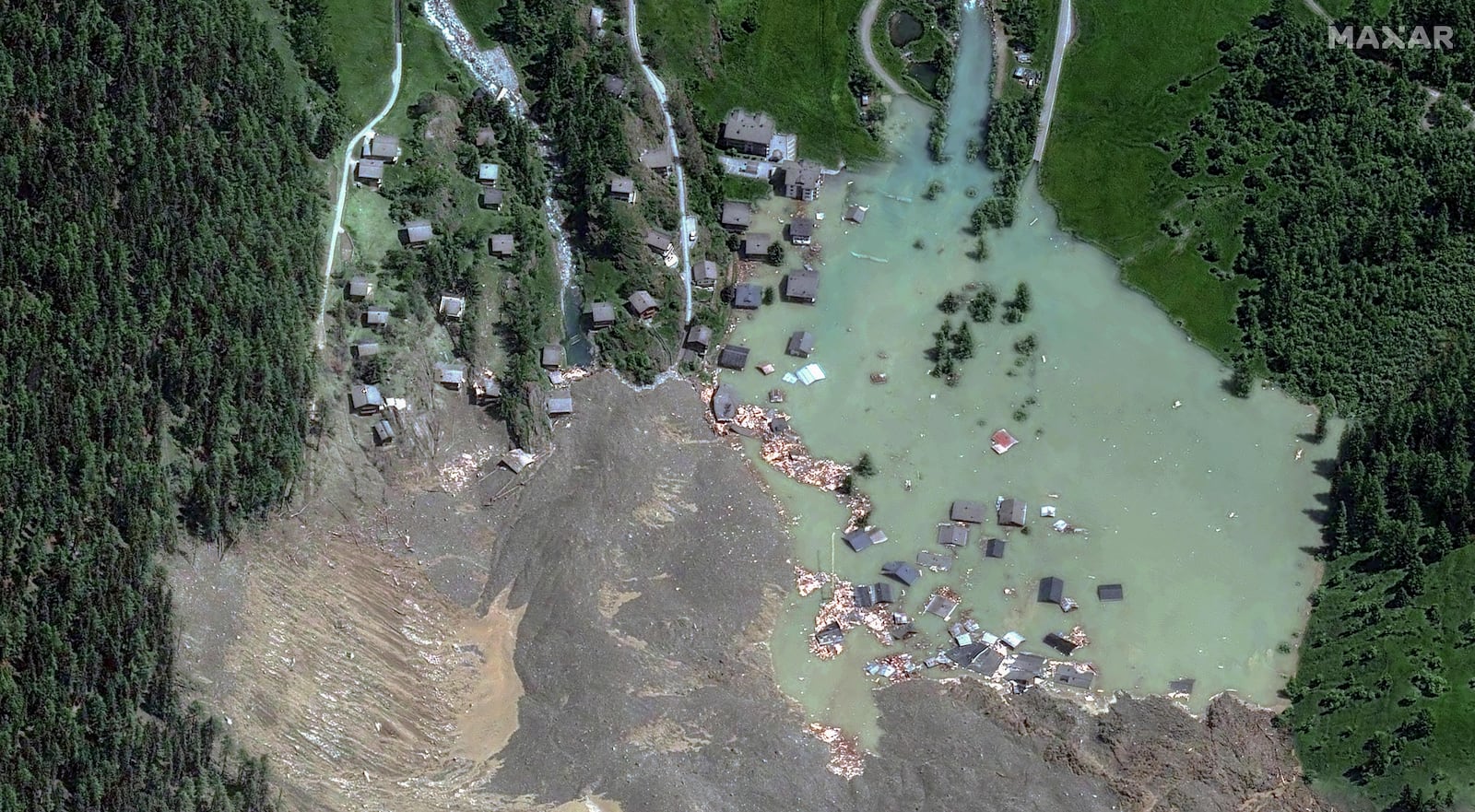 This satellite image provided by Maxar Technologies shows the village of Blatten after suffering a mudslide, in Switzerland, Thursday May 29, 2025. (Maxar Technologies via AP)