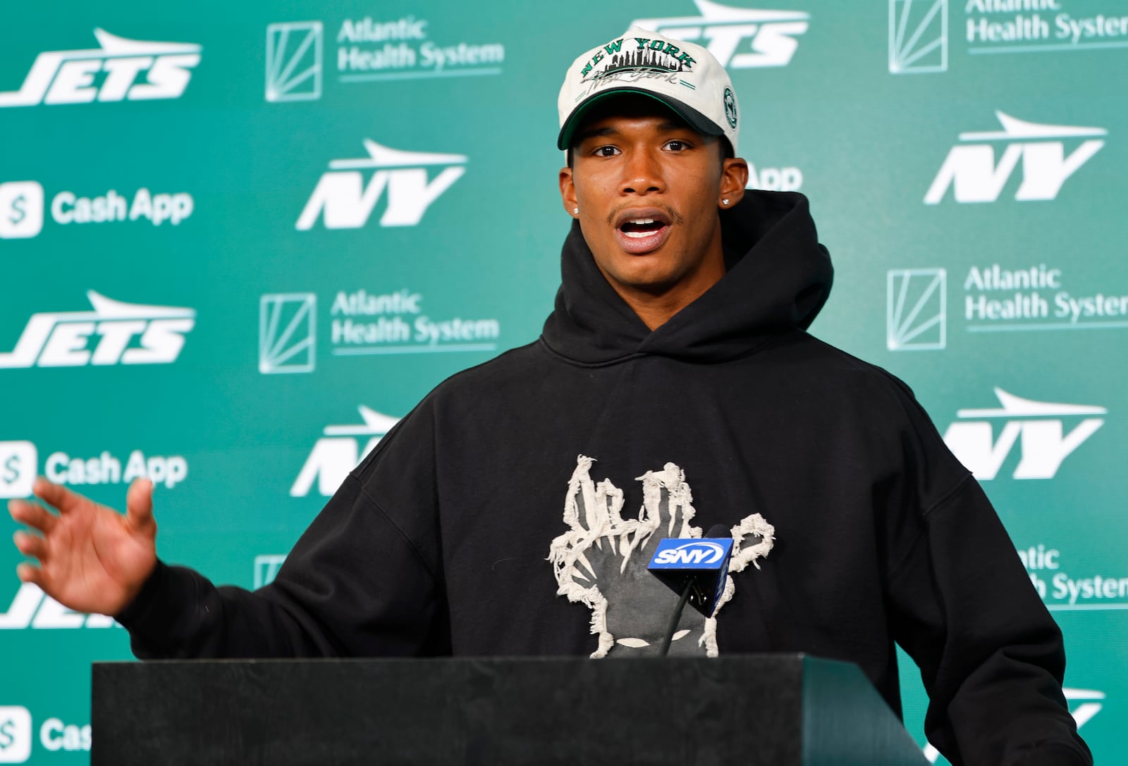 New York Jets wide receiver Garrett Wilson answers questions during a news conference following NFL football practice, Wednesday, May 21, 2025, in Florham Park, N.J. (AP Photo/Noah K. Murray)