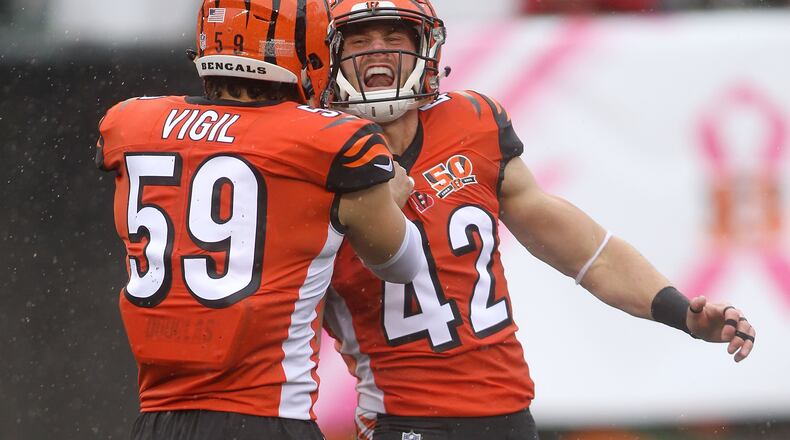 CINCINNATI, OH - OCTOBER 8: Nick Vigil #59 of the Cincinnati Bengals congratulates Clayton Fejedelem #42 of the Cincinnati Bengals after making a defensive stop during the first quarter of the game against the Buffalo Bills at Paul Brown Stadium on October 8, 2017 in Cincinnati, Ohio. (Photo by John Grieshop/Getty Images)