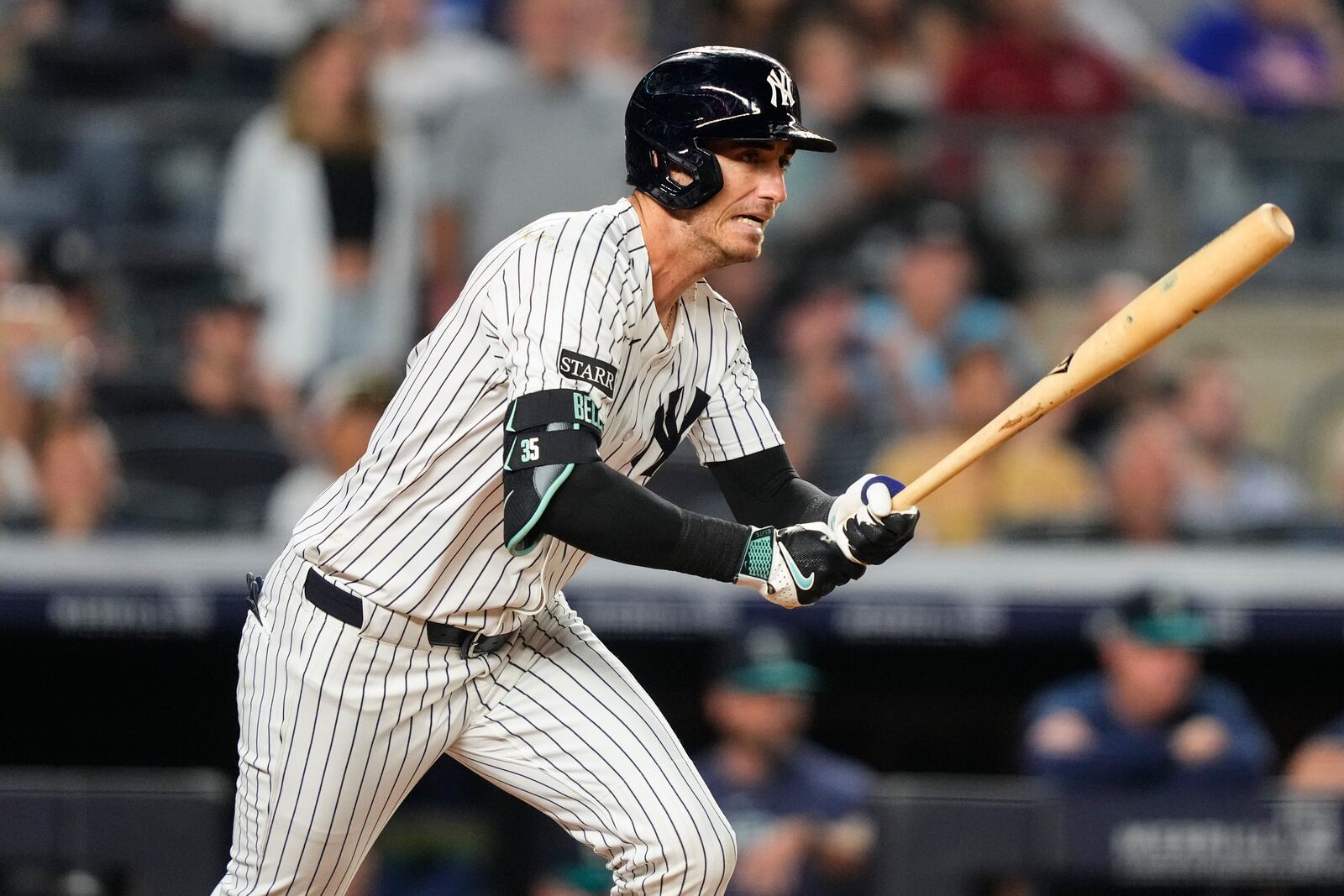 New York Yankees' Cody Bellinger hits a single during the ninth inning of a baseball game against the Seattle Mariners, Thursday, July 10, 2025, in New York. (AP Photo/Yuki Iwamura)