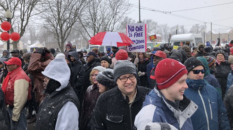 Despite a few inches of snow, people gathered for an annual march on Monday to celebrate the life of civil rights leader Martin Luther King Jr. Marchers walked throughout town and to the Dayton Convention Center in downtown Dayton where a rally was held.