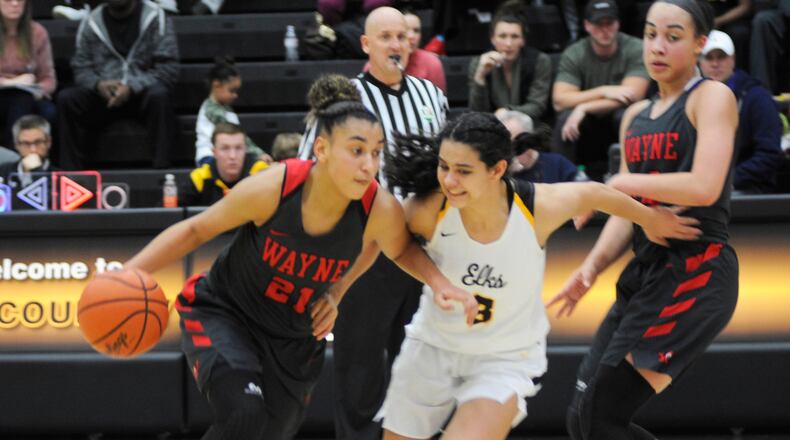 Wayne’s Destiny Bohanon (with ball) is guarded by Centerville’s Amy Velasco. Bohanon was first-team All-Ohio Division I and Velasco D-I special mention. MARC PENDLETON / STAFF