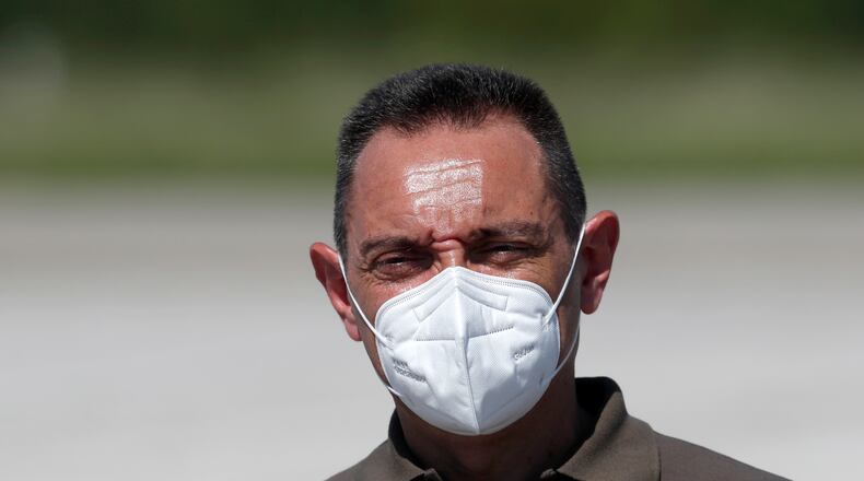 In this photo taken Friday, Aug. 21, 2020, Serbia Defense Minister Aleksandar Vulin wearing a mask to protect against coronavirus speaks after the military exercises on Batajnica, military airport near Belgrade, Serbia. Vulin said Wednesday Sept. 9, 2020, the government decided to suspend all war games "after tremendous and undeserved pressure" from the European Union. (AP Photo/Darko Vojinovic)