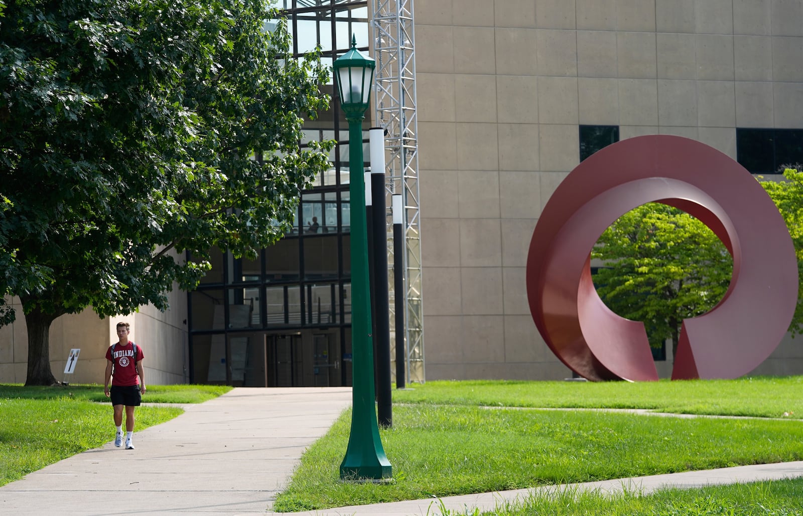 A guest walks on the campus of Indiana University, Thursday, July 17, 2025, in Bloomington, Ind. (AP Photo/Darron Cummings)