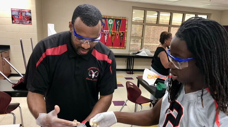 Justin Stone, a science teacher at Trotwood-Madison High School, was as one of 11 Ohio educators recognized as Teacher of the Year by the state board of education. CONTRIBUTED