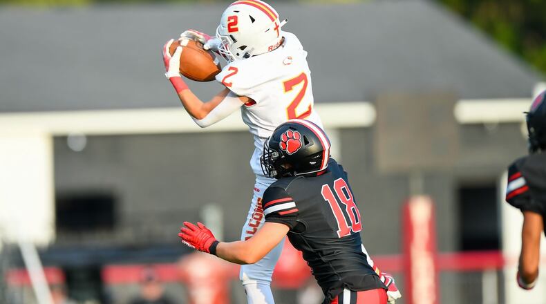 Fenwick's Jackson Kauffman (2) makes the catch in front of Franklin's Tucker Campbell (18) during their season opener on Friday night at Franklin's Atrium Stadium. Kyle Hendrix/CONTRIBUTED