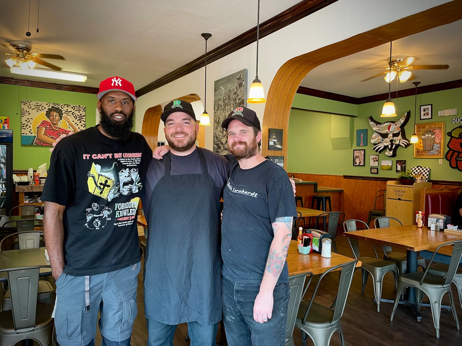 The Ugly Duckling is located at 1430 E. Fifth St. in Dayton’s St. Anne’s Hill Historic District. Pictured (left to right) are owners Dexter Clay, also known as “Uncle Boof,” Zach Jeckering and Mason Schindler. NATALIE JONES/STAFF