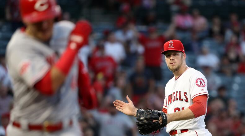 ANAHEIM, CALIFORNIA - JUNE 26:  Ty Buttrey #31 of the Los Angeles Angels of Anaheim looks on after forcing Jose Iglesias #4 of the Cincinnati Reds to ground out ending the game during the ninth inning of a game at Angel Stadium of Anaheim on June 26, 2019 in Anaheim, California.  The Los Angeles Angels of Anaheim defeated the Cincinnati Reds 5-1.  (Photo by Sean M. Haffey/Getty Images)