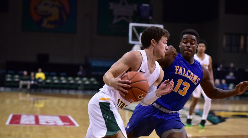 Wright State’s Cole Gentry tries to drive past Notre Dame College’s Larenz Thurman during Wednesday’s exhibition game at the Nutter Center. Joseph Craven/CONTRIBUTED